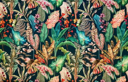 A dense tropical botanical pattern featuring a variety of leaves, flowers, and berries in shades of green, pink, blue, and orange on a dark teal background. Pattern repeat: 68cm / 26.7inch